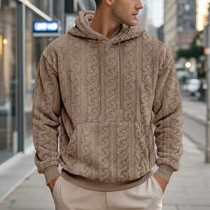 Detailed view of brown teddy fleece hoodie featuring textured cable knit pattern and pocket