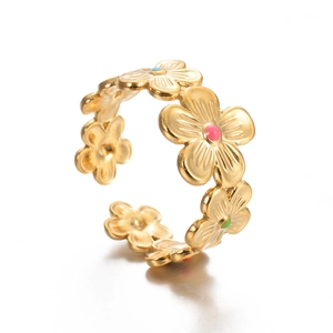 Detail of a gold floral open ring with colorful enamel petals and tiny pearl accents