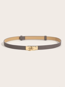 Detail of grey lychee texture leather belt with golden turn-lock buckle closure