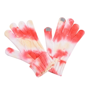 Detail of red tie-dye knit gloves featuring touch screen fingertips and cable texture