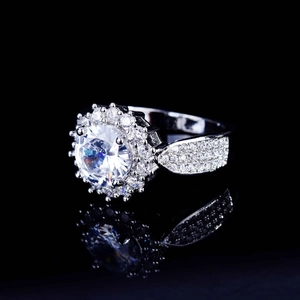 Detailed macro view of a sparkling round-cut zircon ring with micro-pave setting on silver