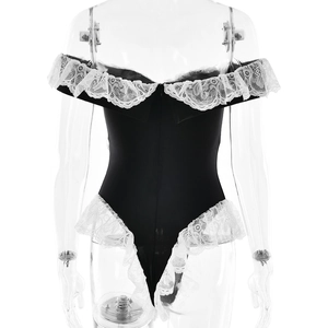 Close-up of black backless bodysuit with white lace trim and off-shoulder detail