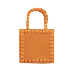 Orange PVC jelly handbag with all-over rivets and U-shaped handles on white background