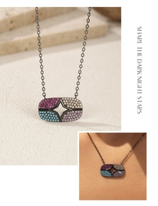 Detailed macro view of S925 silver star pendant with colorful crystal embellishments