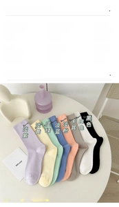 Detail view of cotton mid-calf socks in eight soft pastel colors and product specifications