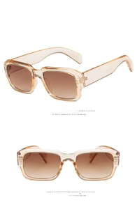 Detail view of champagne square frame sunglasses with tea gradient lenses and non-slip temples