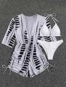 Detailed flat lay of white 3-piece bikini set with a black and white mesh cover-up