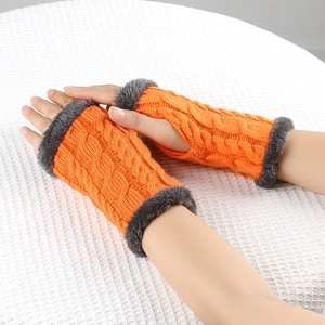 Detailed cable knit pattern on orange fingerless gloves with gray faux fur trim