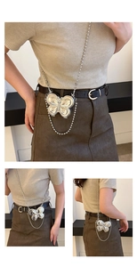 Close-up detail of silver metal butterfly box bag with elegant beaded chain strap