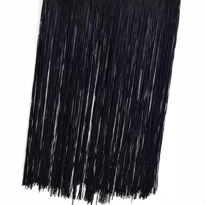 Women's sleeveless dress featuring dense black tassel fringe details at the hemline