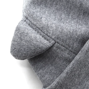 Detail shot of heather grey knit fabric and cute 3D animal ear design on beanie
