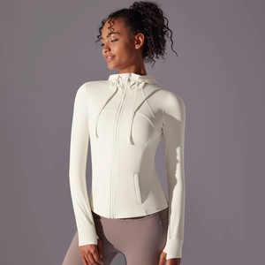Detailed close-up of hooded sports jacket with thumbholes and invisible side zipper pockets