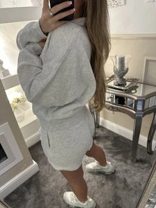 Mirror selfie of a grey athletic lounge set featuring a hoodie and matching shorts