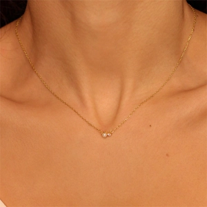 Minimalist 18K gold plated stainless steel necklace with pearl and zircon on model