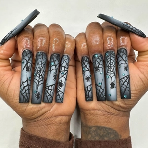 Halloween black and white spider web press-on nails with blue rhinestones long square shape