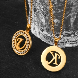 Gold stainless steel initial U and K pendant necklaces with pavé zircon accents