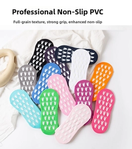 Detail showing non-slip PVC grips on colorful cotton yoga and trampoline socks