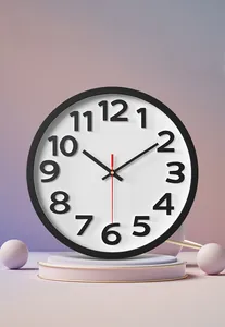 Detail of 12-inch wall clock featuring black numbers and red second hand on pink backdrop