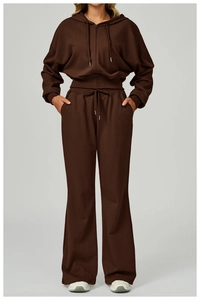 Detail of deep brown high-waisted wide-leg sweatpants and matching zip-up hoodie set