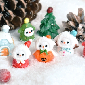Christmas resin figurine set with Santa, snowman and tree in a snowy winter scene