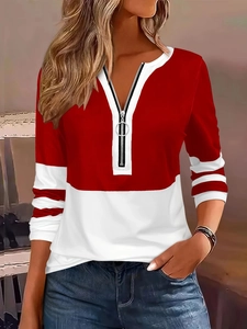 Detail of V-neck zipper closure and red-white contrast stripe pattern on casual sweatshirt