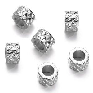 Detailed view of silver CCB plastic beads with quilted texture and large holes for DIY jewelry