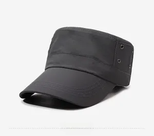 Detail view of dark grey flat top cap with side metal eyelets and reinforced stitching