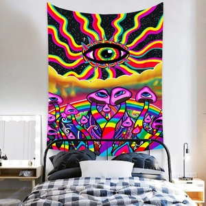 Detail of psychedelic mushroom tapestry with eye design hanging in a modern bedroom