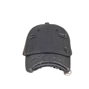 Washed dark grey baseball cap with distressed rip details and silver metal ring accents