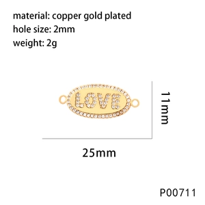 Macro detail of LOVE letter charm in gold-plated copper with cubic zirconia stones