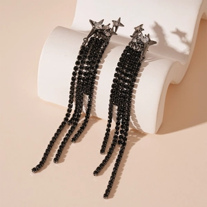 Detailed view of dark luxury zircon star earrings with long black rhinestone tassels