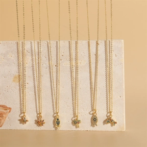 14K gold plated necklaces featuring zircon dolphin and ocean life pendants on stone