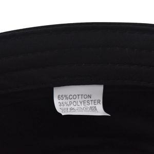 Detail view of the fabric care label showing 65% cotton and 35% polyester blend info