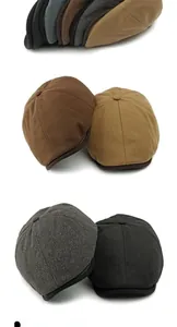 Vertical stack of retro newsboy caps in brown, grey, and black textured tweed fabric