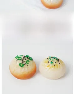 Macro detail of simulation pan-fried buns with realistic green onion and sesame seeds