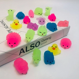 Colorful animal mochi squishy stress relief toys arranged on a white decorative box