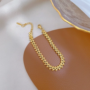 Minimalist gold V-shaped chain bracelet with lobster clasp and adjustable link on silk