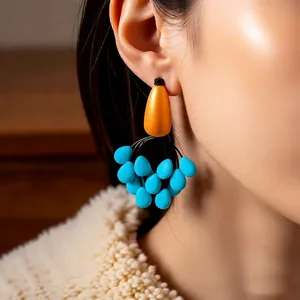 Vintage bohemian drop earrings with yellow teardrop studs and turquoise beaded tassels