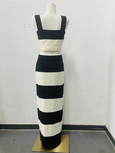 Close-up of the two-piece black and white striped knit set with cropped vest and maxi skirt