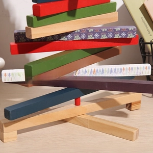 Detail of creative wooden Christmas tree desk ornament with stacked colorful timber bars