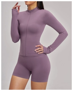 Close-up of seamless ribbed yoga jacket with thumb holes and mock neck design
