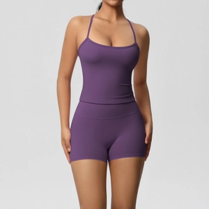 Detail view of the purple yoga set featuring a slim fit camisole top and high waist shorts