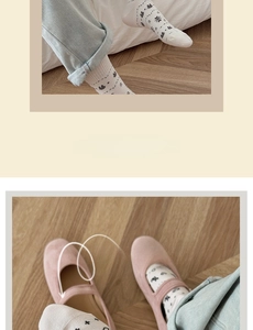 Detail of white crew socks with bear pattern and pink velvet Mary Jane shoes