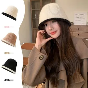 Detailed view of plush knit bucket hats in white khaki and black colors for winter