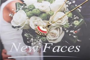 Detailed shot of gold Turkish evil eye pendant with vibrant zircons on a fashion magazine