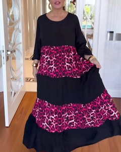 Detail of elegant leopard print tiered maxi dress with long sleeves and round neckline