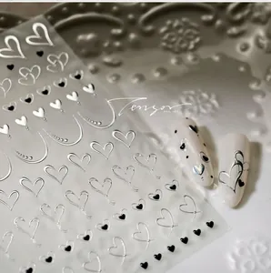 Detail of silver hollow heart and black solid line 3D metallic nail art stickers