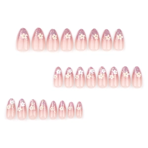 Pink gradient almond press-on nails with white 3D flowers and colorful glitter accents