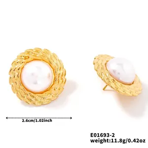 Detailed view of 2.6cm vintage gold pearl earrings with textured metallic borders