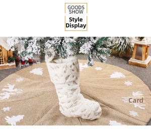 Detail of white faux fur Christmas stocking with golden feather foil print on fabric